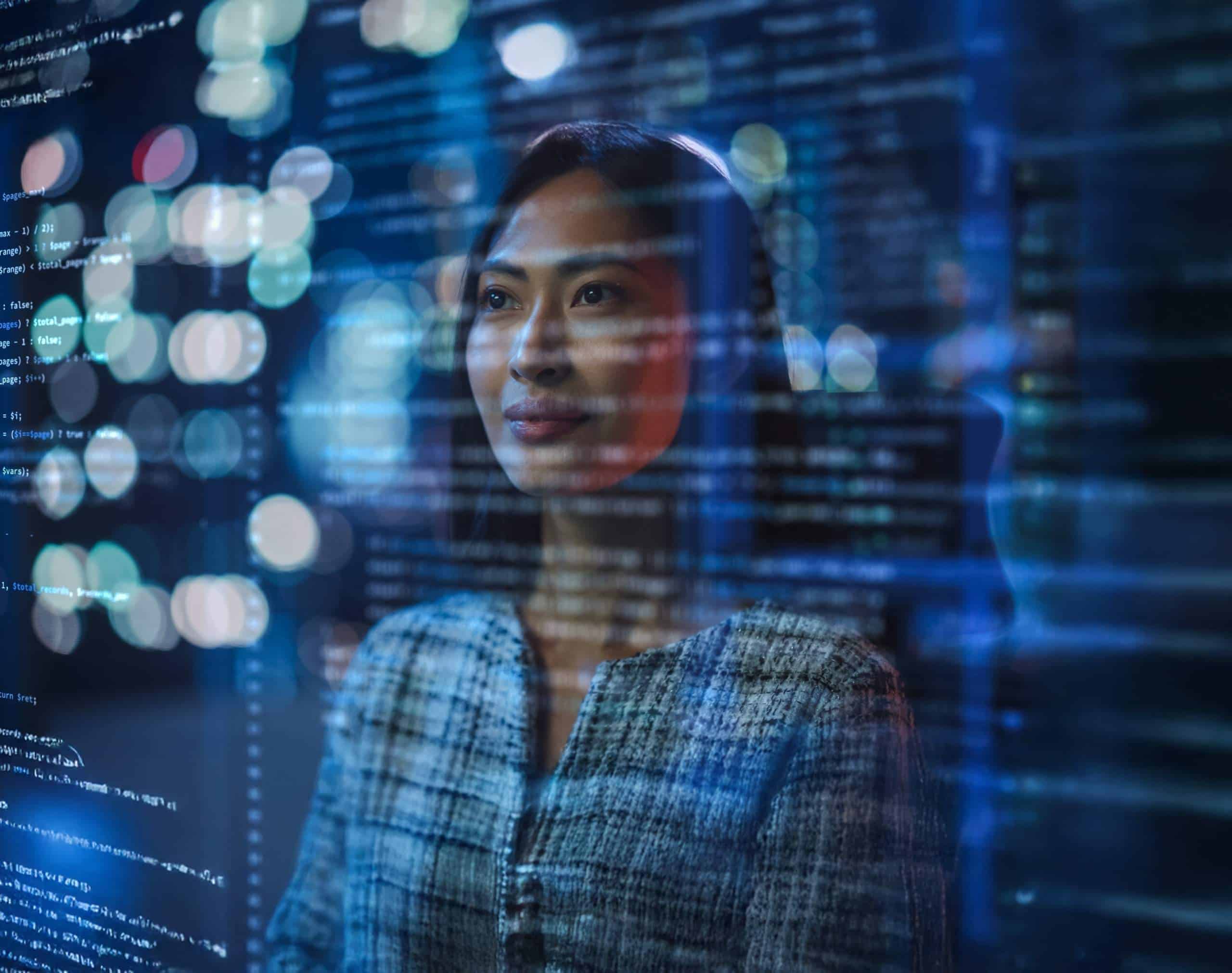 Étudiante évoluant dans un environnement numérique avec des données et connexions digitales illustrant la dimension internationale et les campus du Groupe Ionis